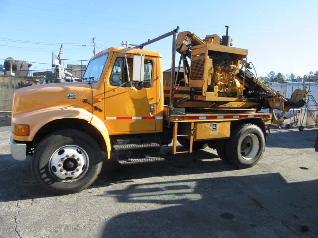 Click for price on this 2001 IHC 4700 Guard Rail Post Driver Truck